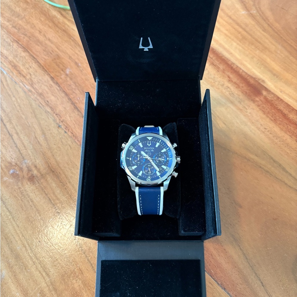 Blue Bulova Wristwatch with Round Dial and Silver Bezel